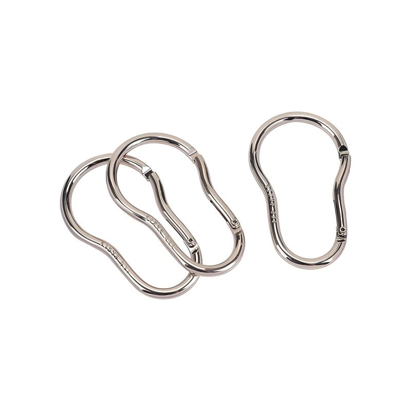 Selection of locking carabiners in different colors and sizes laid out on a wooden surface, showcasing variety and build quality