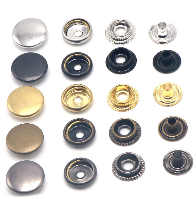 Zinc alloy snap button in silver finish on handbag flap