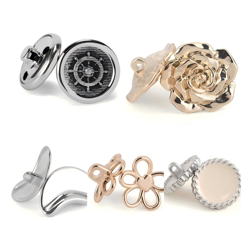 Metal button fasteners arranged on a tailoring table beside fabric swatches and sewing tools, showing fashion design process
